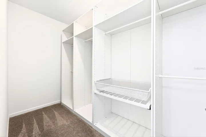 The Primary walk-in closet provides room for all your wardrobe with custom storage.