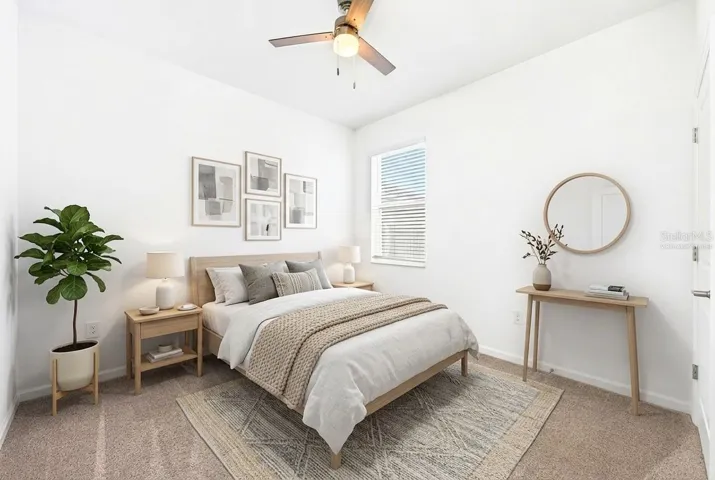 A MAIN-FLOOR BEDROOM and full bath provide excellent flexibility for guests, a home office, or multigenerational living. Virtually Staged