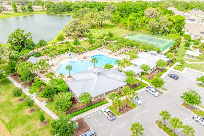 Residents of Tohoqua enjoy RESORT-STYLE AMENITEIS, including a sparkling community pool, clubhouse, fitness center, tennis courts, playground, and dog park, along with scenic walking trails and green spaces throughout the neighborhood.