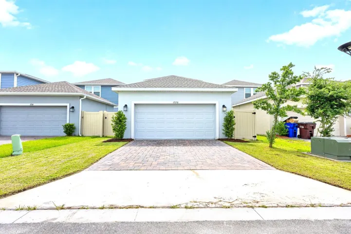 The garage has been upgraded with PROFESSIONAL-GRADE EPOXY FLOORING and OVERHEAD STORAGE (2022), adding both style and functionality.