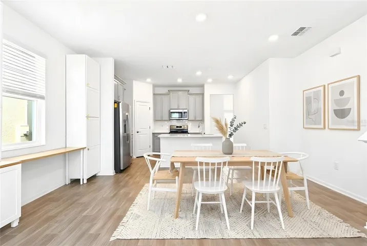 The charming Dining space is perfect for casual meals or quiet dinners at home. Virtually Staged
