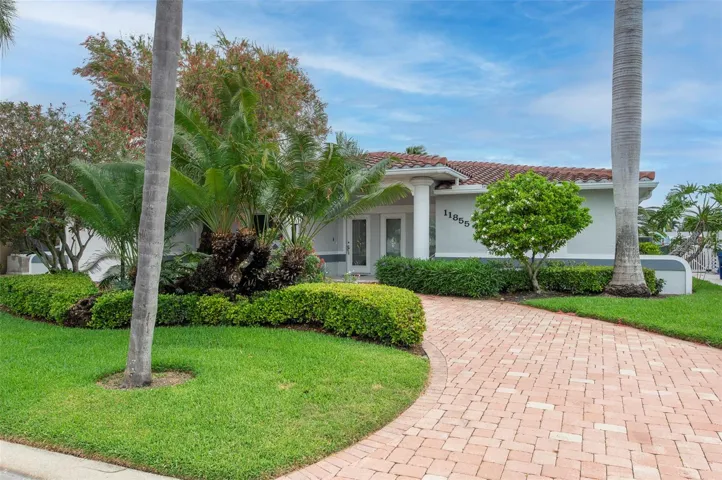 Arrive home on your brick paved circular driveway