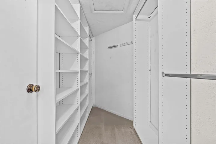 Walk-in closet in primary suite provides ample storage