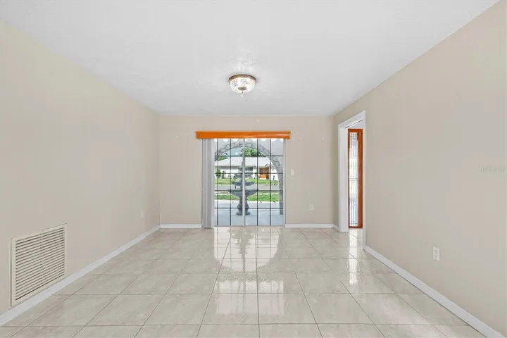 Versatile space offers endless possibilities—perfect for a formal dining area, cozy family room, or personalized living setup