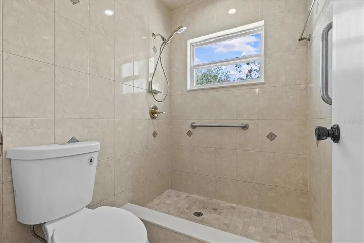 Primary bath features walk-in shower for added convenience