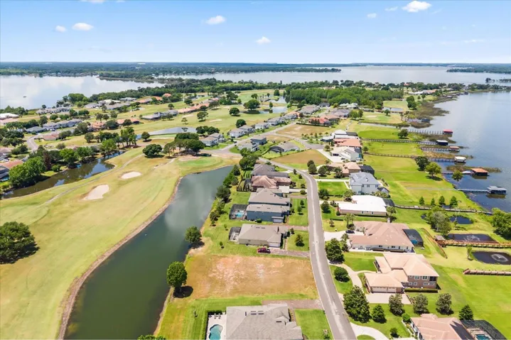 Lot in front, view of causeway entrance to Deer Island with Lake Beauclair on left and Lake Dora on right