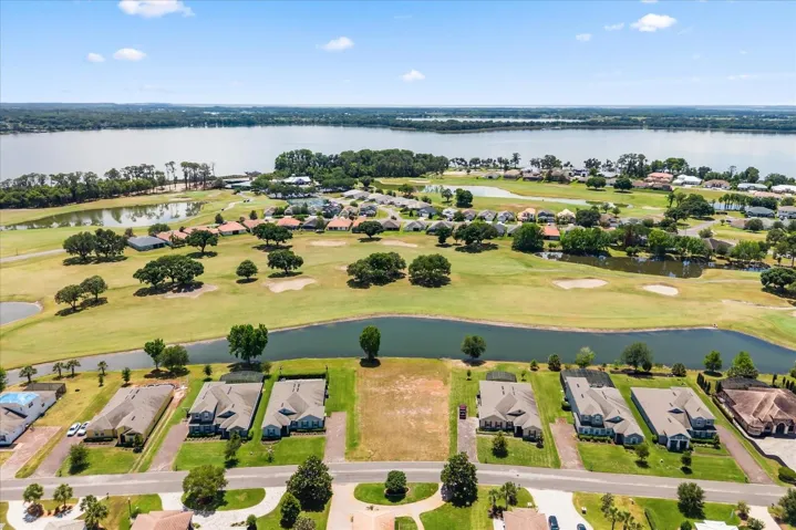 Lot front center, views of golf course and Lake Beauclair with Lake Carlton in distance