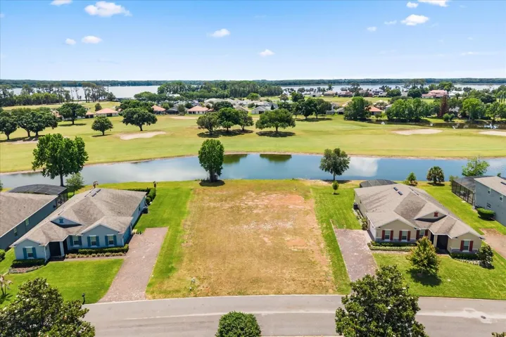 From front, pond at back of lot and Lake Beauclair in distance
