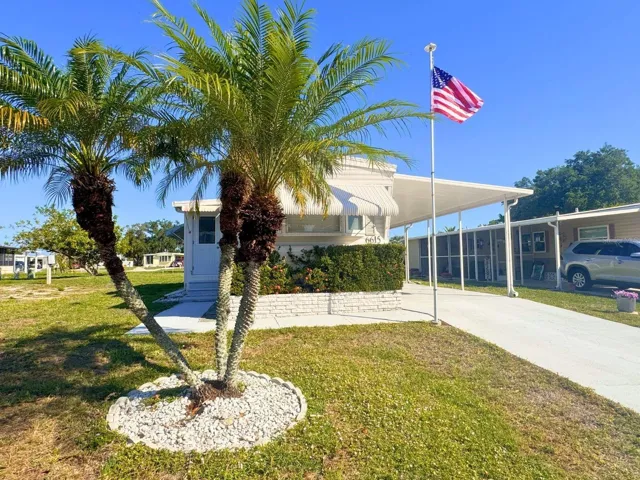FrontExterior_6615HauliCt_NorthPort_TropicalLandscaping.jpg