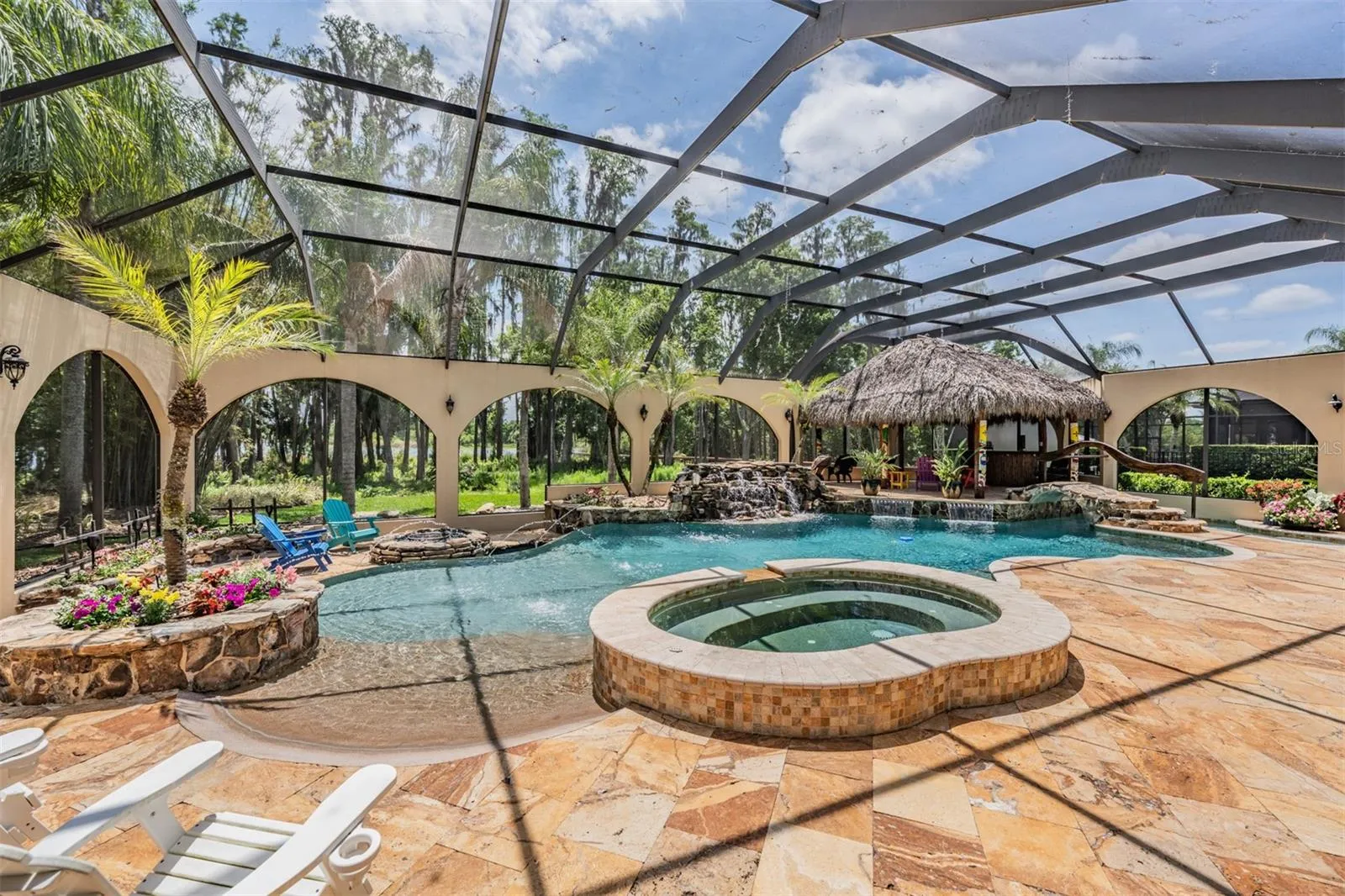 Private Pool Oasis with it's own fountains, waterfalls, spa, Tiki Hut and beach entry pool