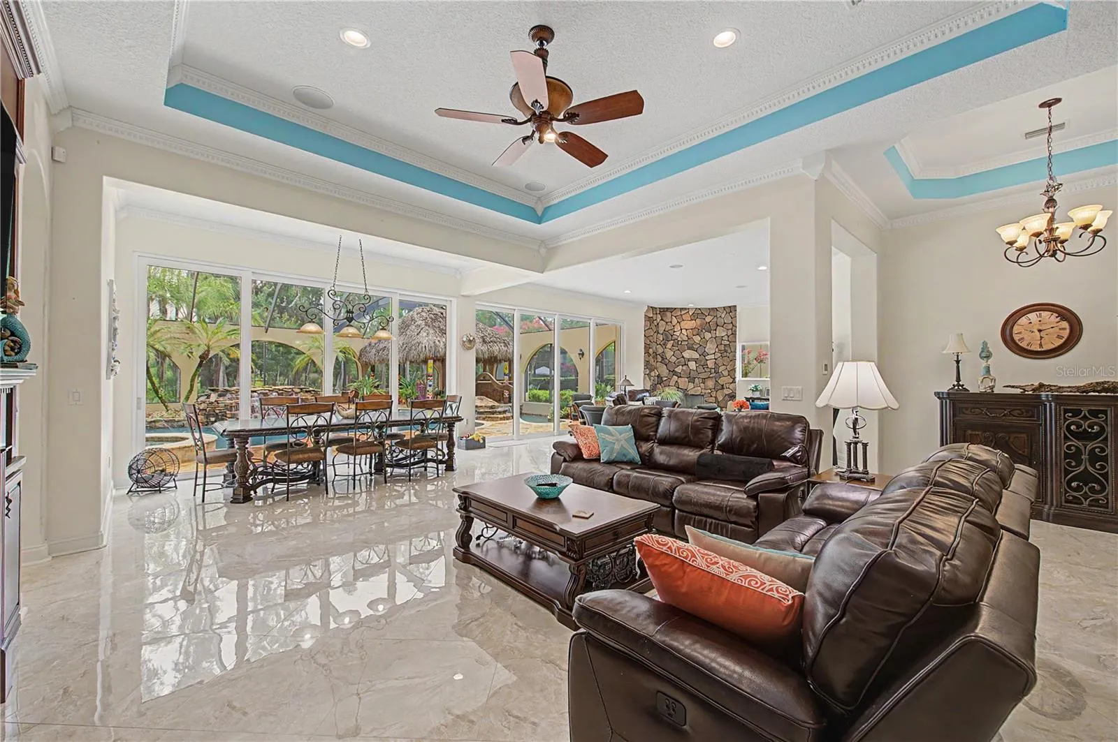 Expansive Family Room with view of Beautiful Pool Oasis, Backyard and Lake