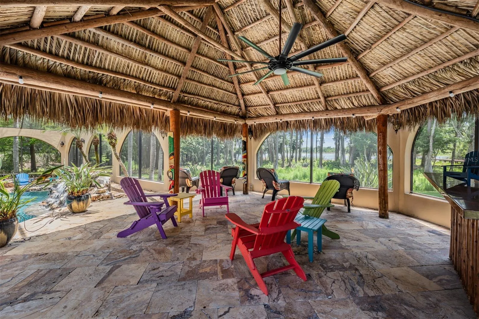 Tiki Hut with views of the Pool, Lake and Backyard.