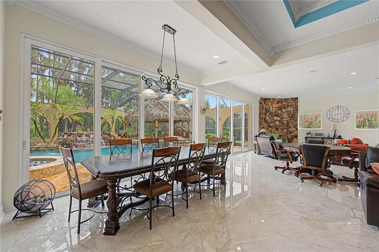 Expansive Family Room with view of Beautiful Pool Oasis, Backyard and Lake
