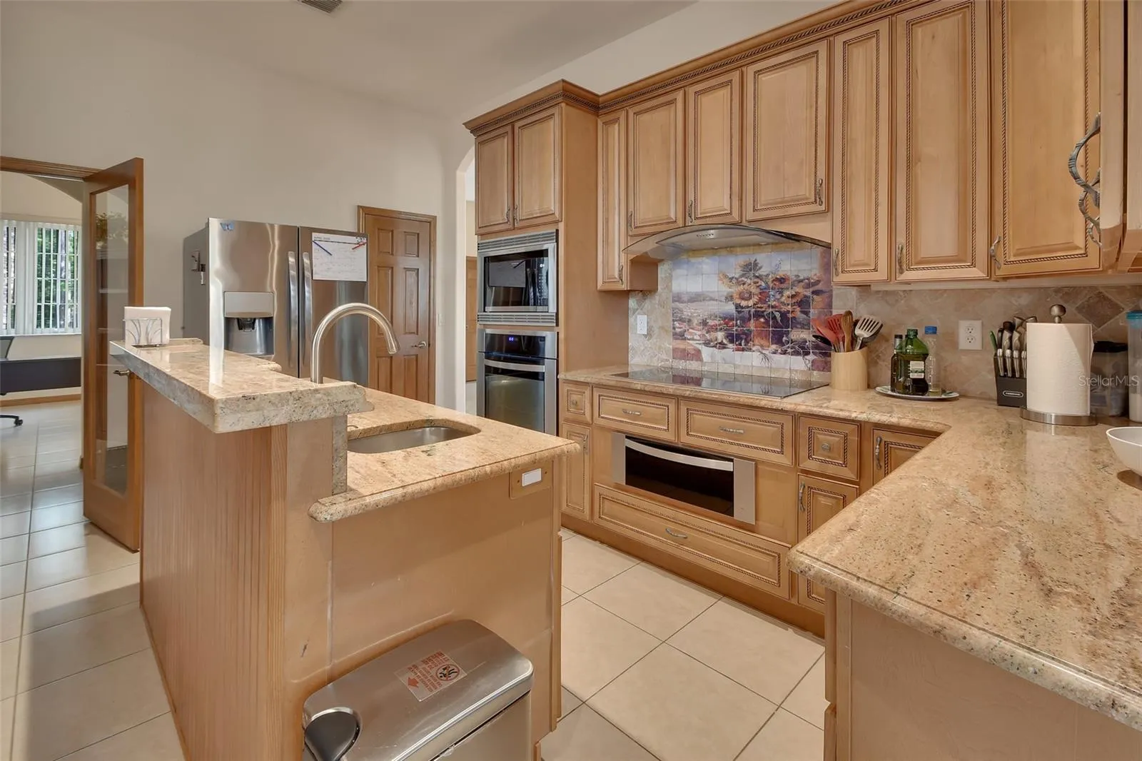 View of oven area, and cooktop