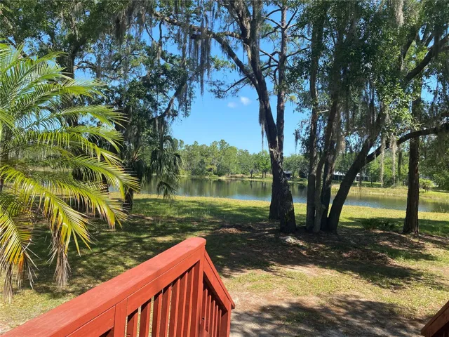 Front deck offers a relaxing view of the lake.ENJOY 4.4 +/- ACRES AT YOUR PRIVATE LAKEFRONT RETREAT AND EXPERIENCE AMAZING COUNTRY LIVING. AS AN ADDED BENEFIT YOUR PROPERTY DEED QUALIFIES YOU TO JOIN RIVER RANCH PROPERTY OWNERS ASSOCIATION, INC. (RRPOA)