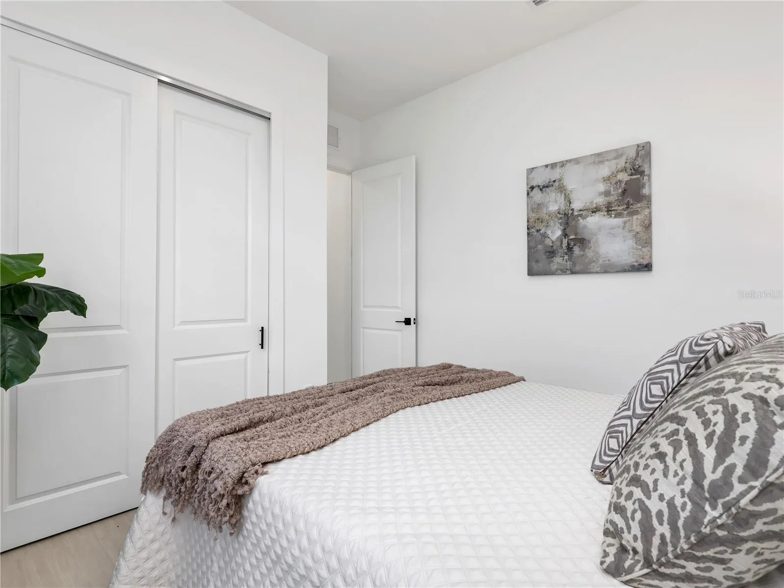 White walls complimenting light wood-finish flooring photos used from another listing to show what it would look like with furniture
