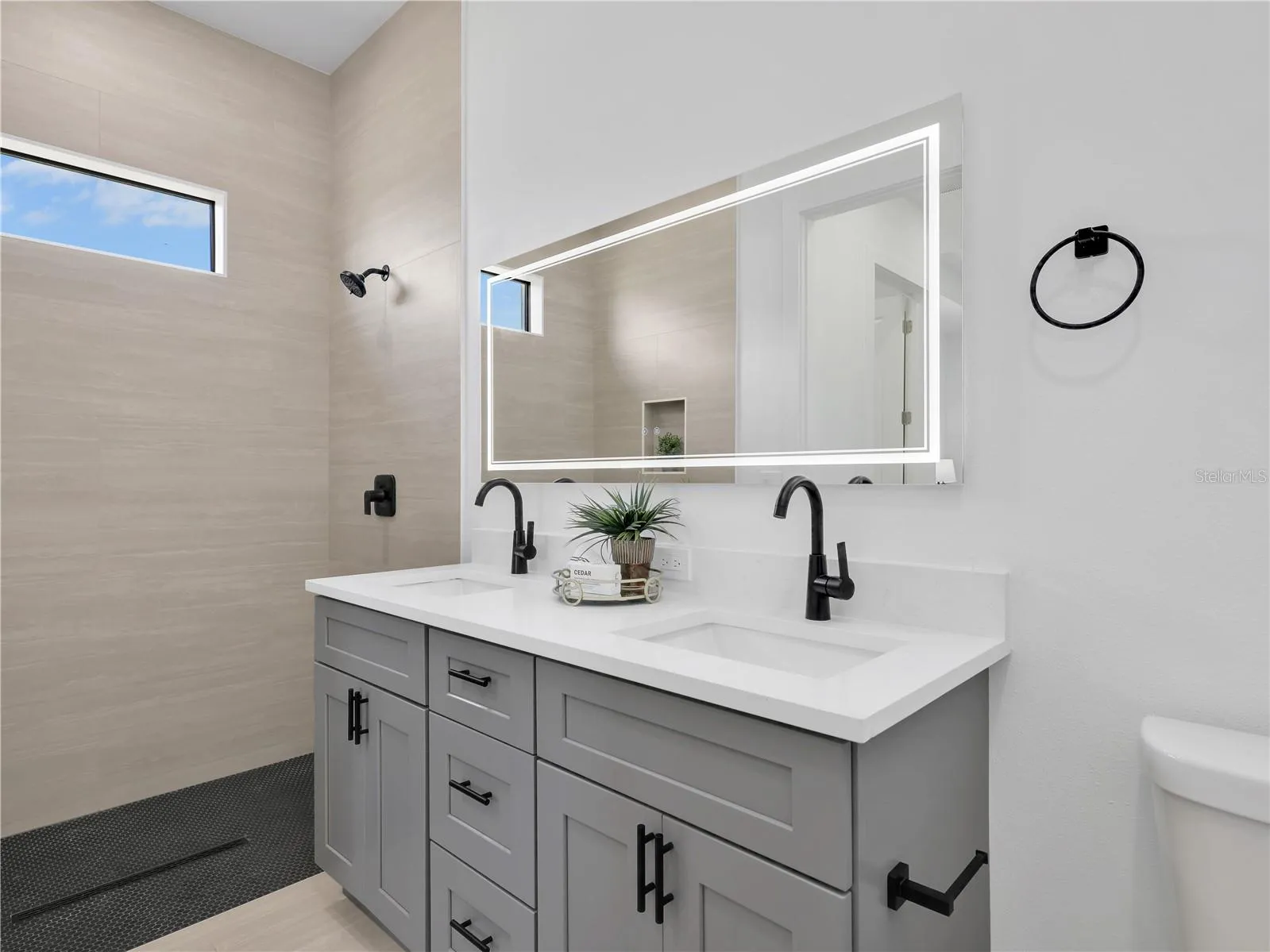 Dual vanity with white countertop and gray cabinetry photos used from another listing to show what it would look like with furniture