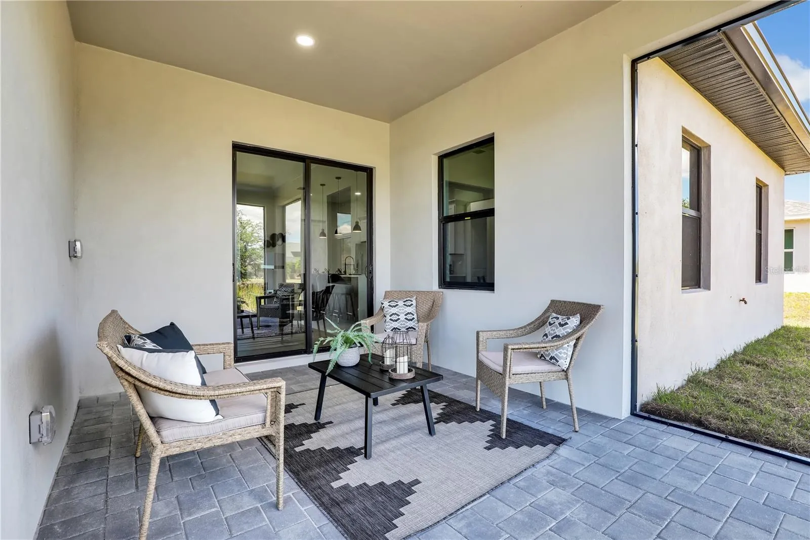 Covered patio featuring paver flooring, ecessed lighting, and a sliding glass door photos used from another listing to show what it would look like with furniture
