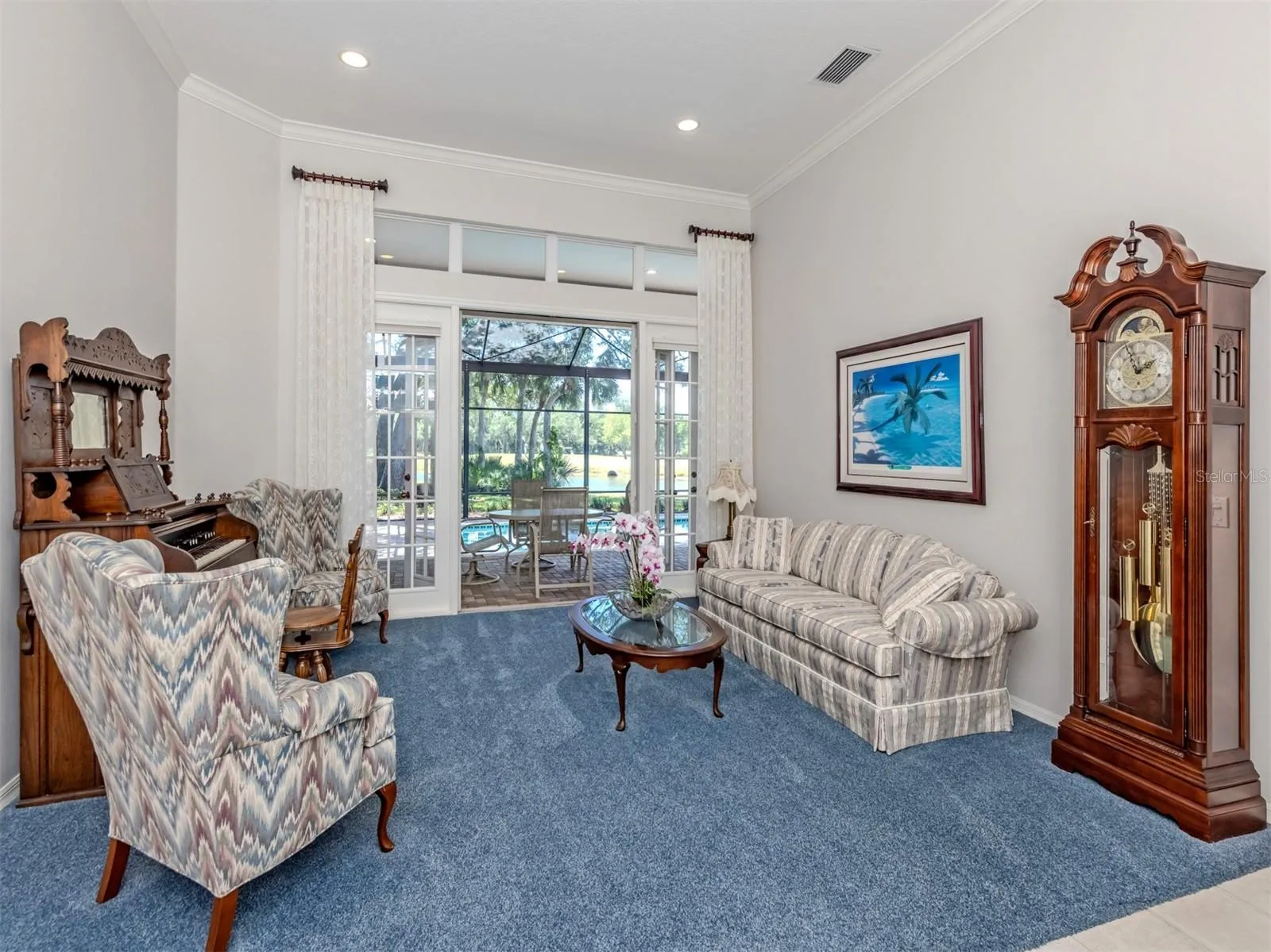 Formal Living Room with French doors overlooking pool and private view