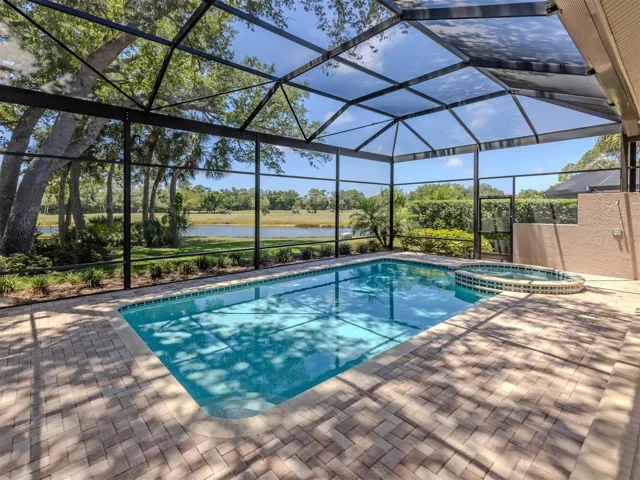 Layered pavered heated pool and spa with outdoor shower.