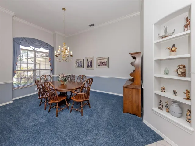 Formal Dining Room with brass chandlier