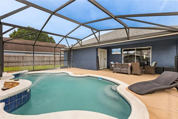 Back exterior with pool and patio