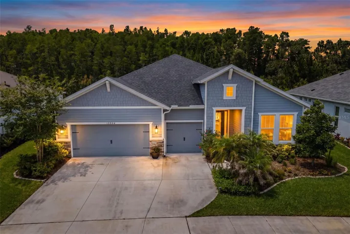 Rare single-story ICI home in Asturia’s Phase 4 with four bedrooms, three baths, a 3-car garage, and a wooded view with no rear neighbors.