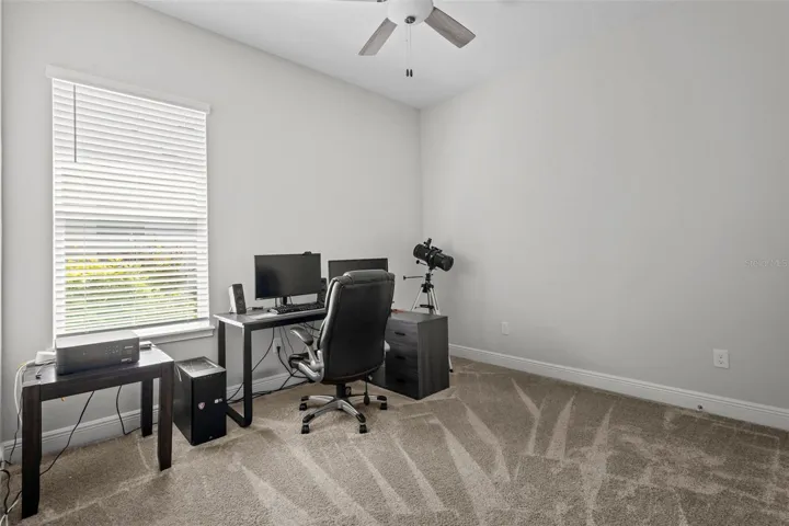 Private guest bedroom located along a separate hallway.