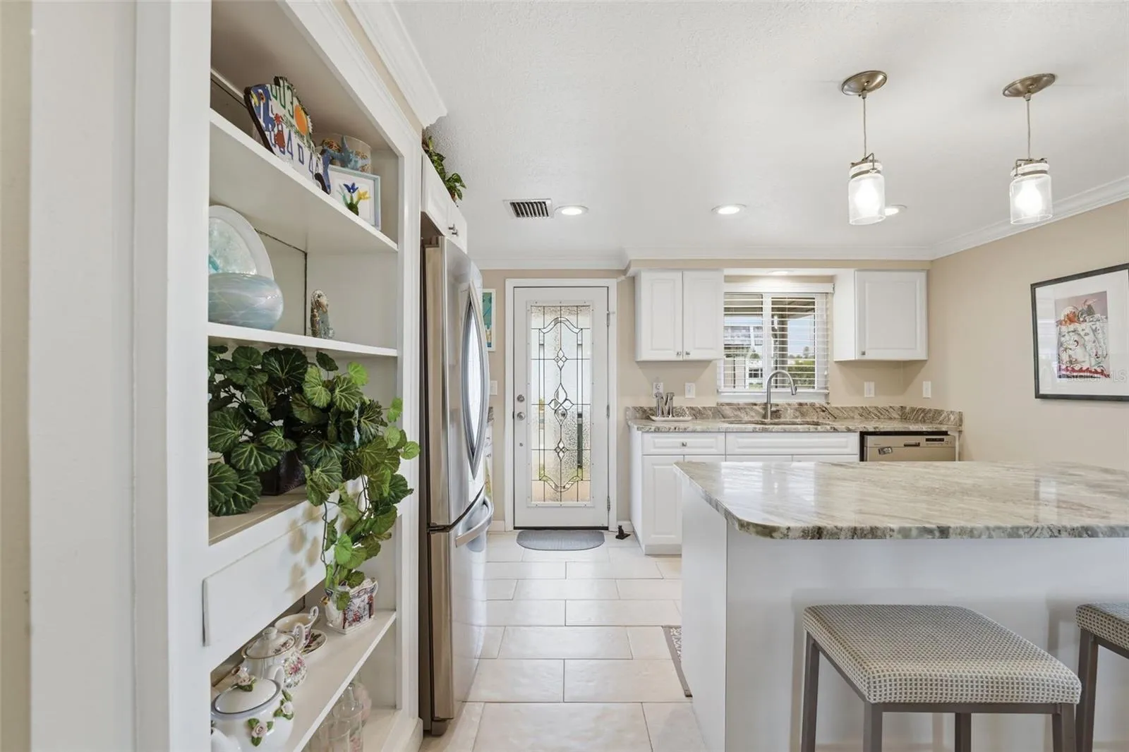 Built in mirrored cabinet to the left.