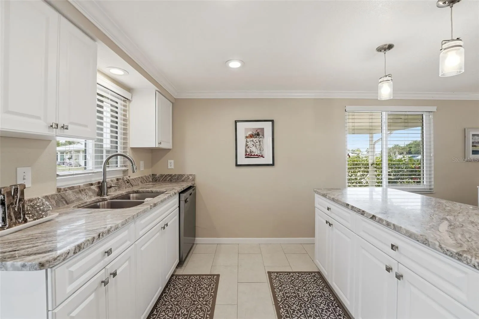 Can lighting, good size windows, and pendant lights over the island.