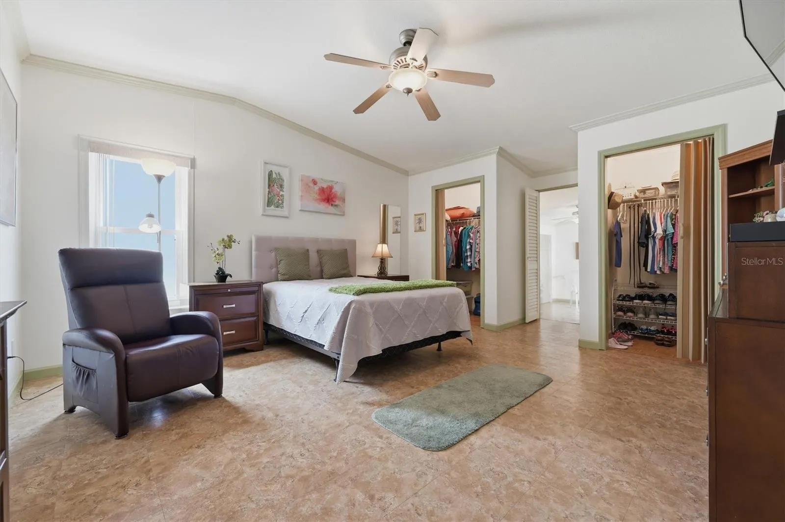 Large Main bedroom with double closets, and access into office, den, or additional flex room.