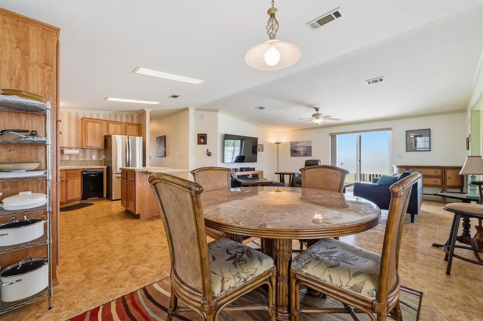 Dining area.  Marble top table, chairs and buffet can remain.