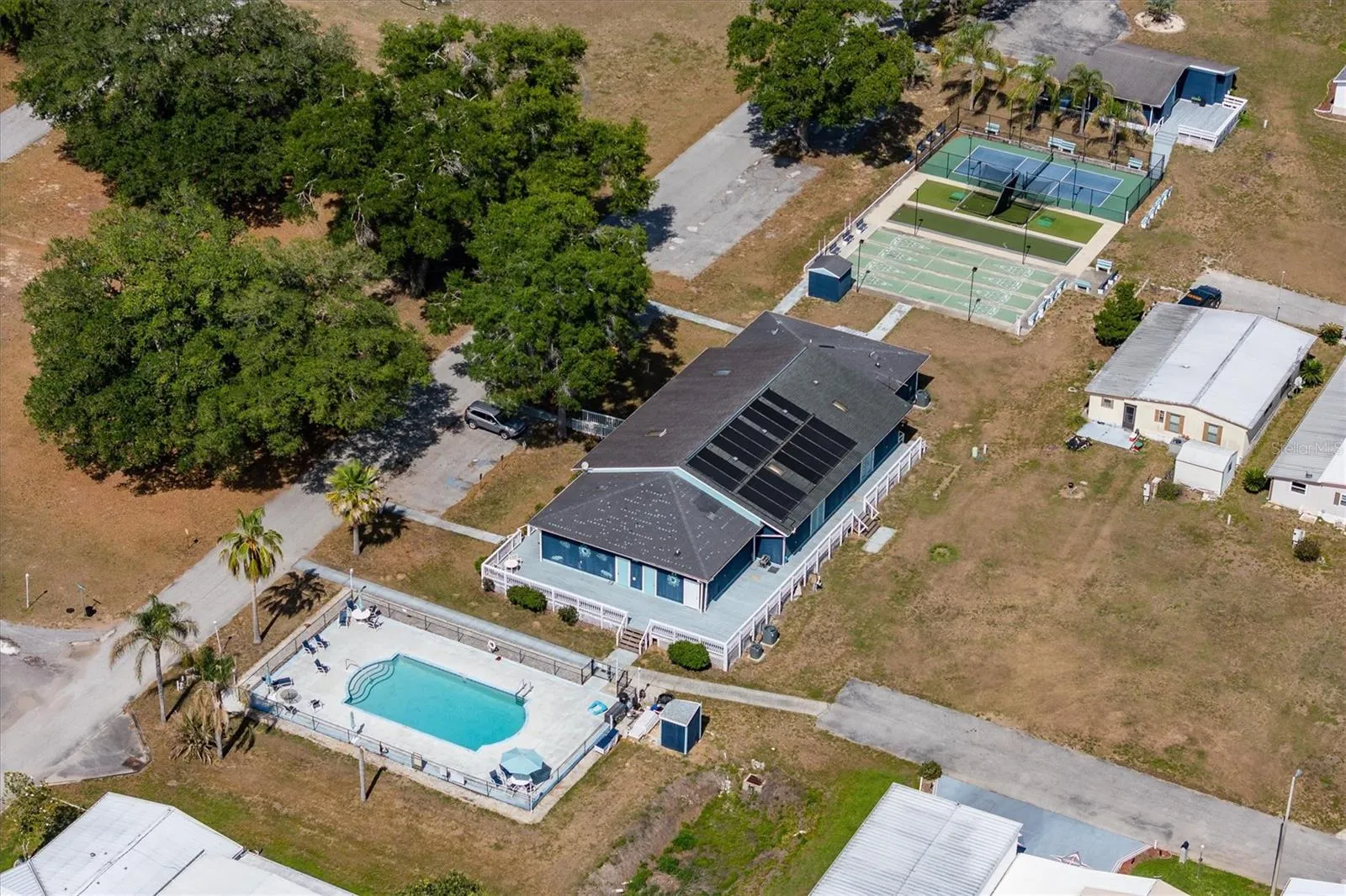 Great amenities with a pool, large clubhouse with games, tables and seating, kitchen,  and bacci ball, shuffleboard and pickleball courts.