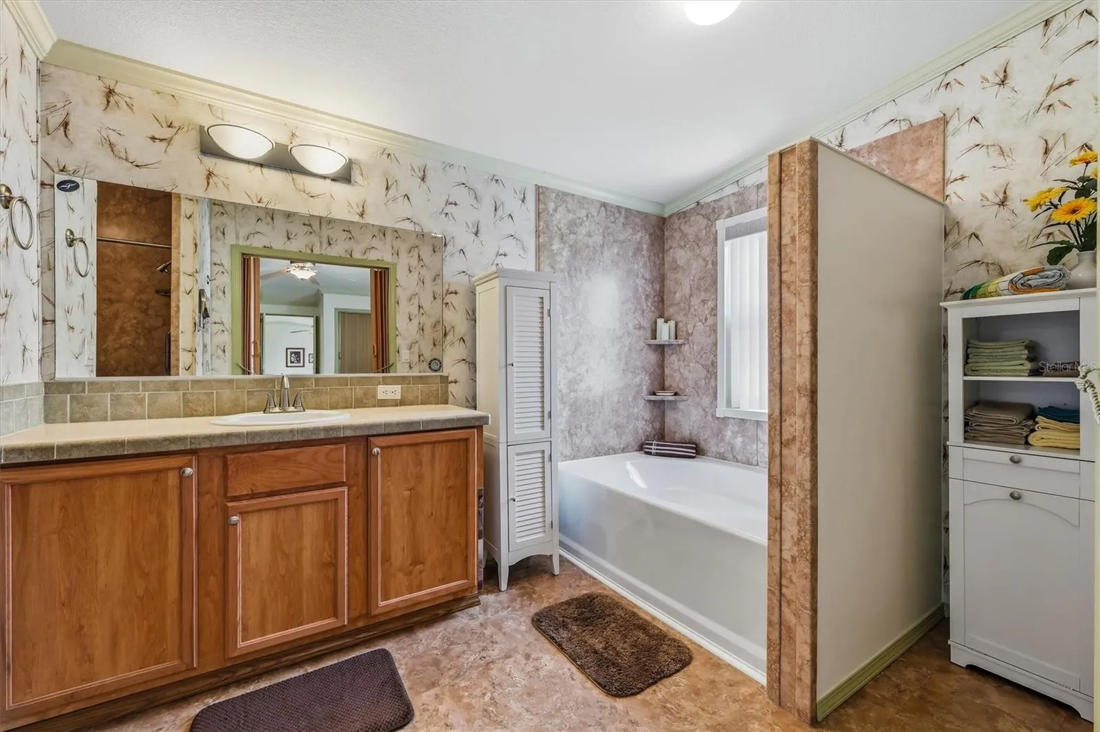 Main bathroom with separate tub and separate shower