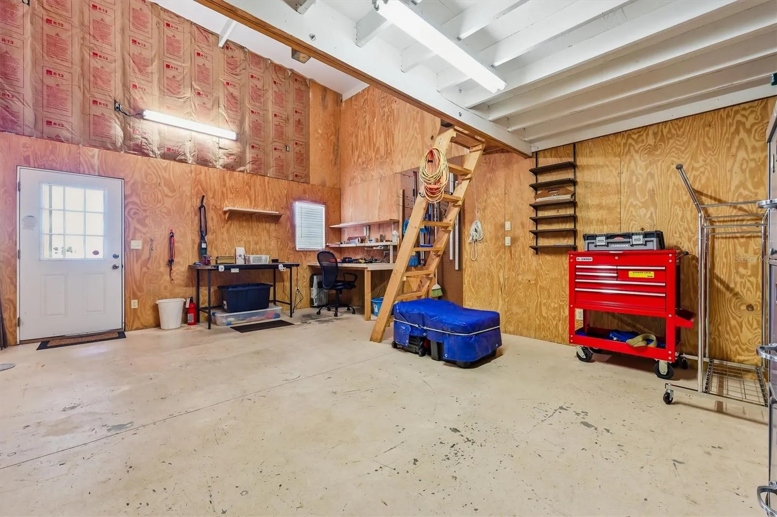 Workshop with large loft and pulley lift.