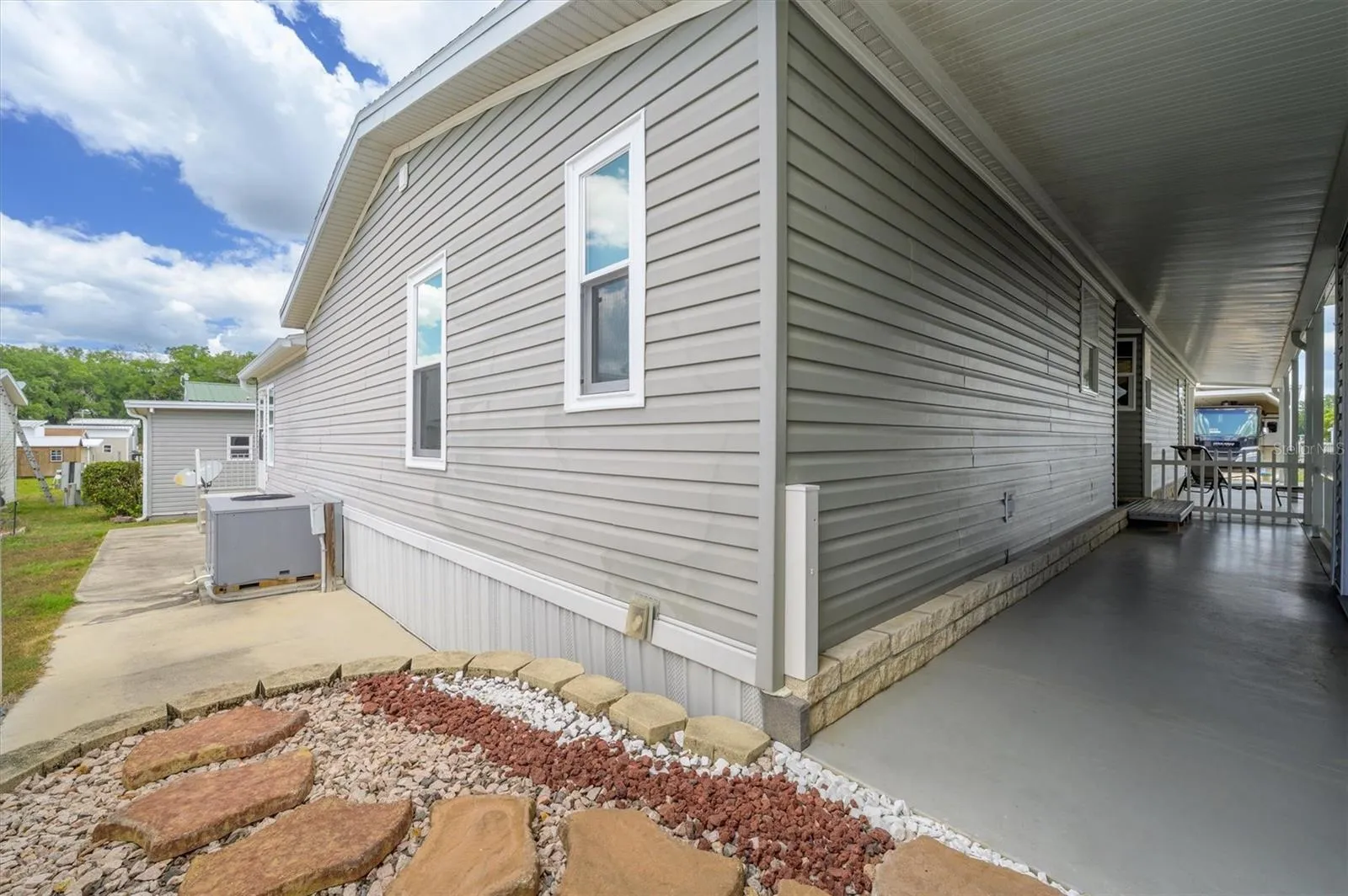 Hallway to backyard .   Owners had small hot tub where pavers are now.