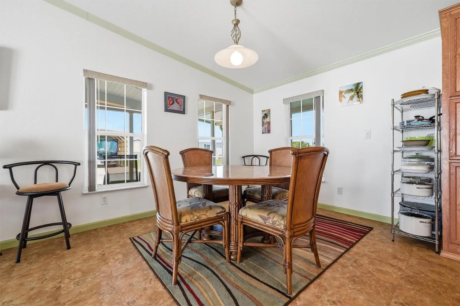 Dining area with picture window views and a lot of light