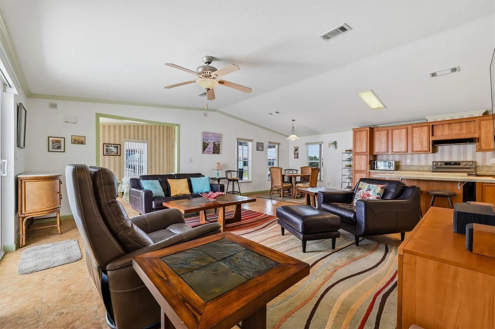 Now to the home!  Beautiful open floorplan - Living room, dining area and kitchen.