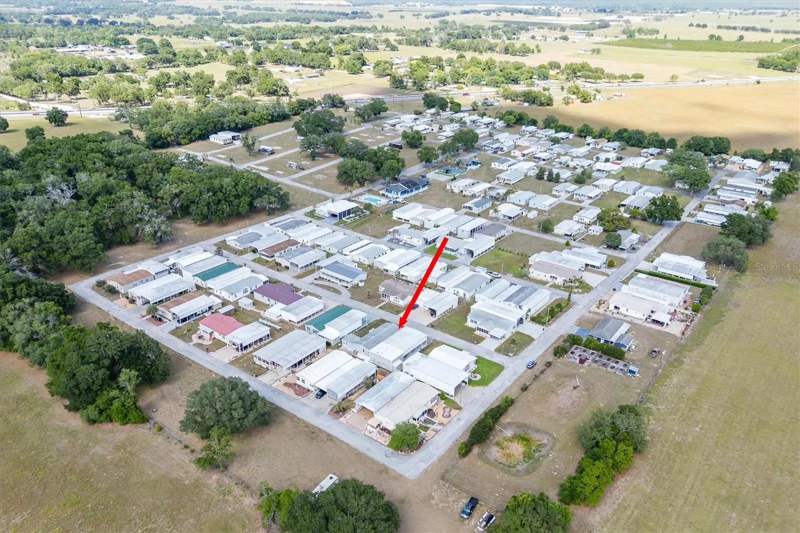 Palm Manor under new ownership of Valleo Homes,  but you do own your own land.  This home sits on one and 1/2 lots,  so has lots of room and even a small yard.  Dogs are allowed.