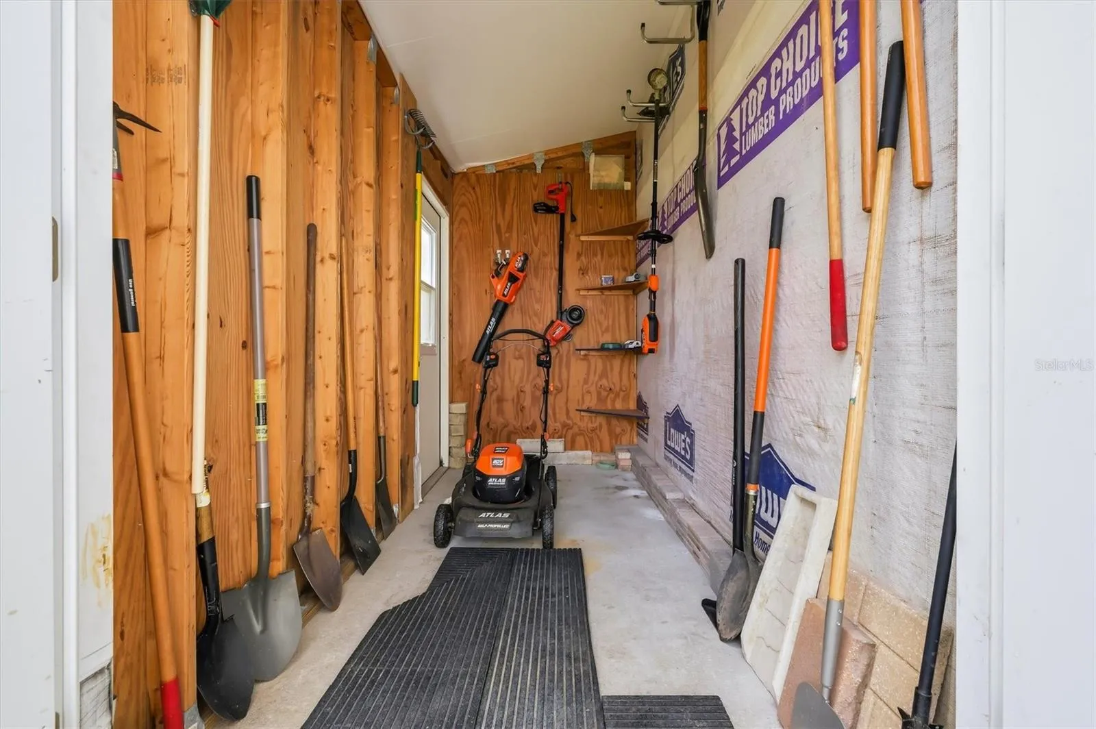 Inside of tool shed .  Mower and tools can remain.