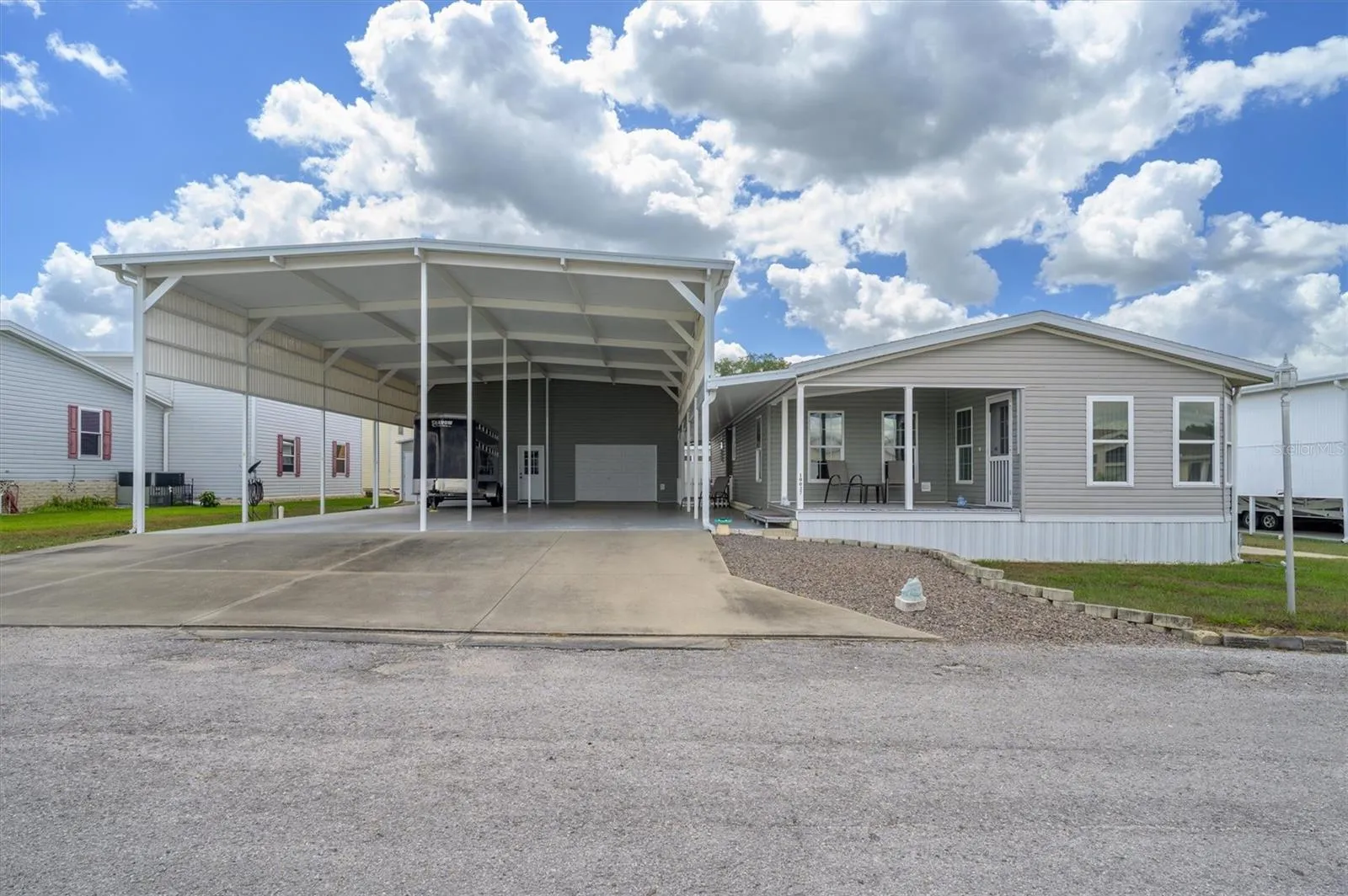 Amazing home with wonderful RV Port which could accommodate large RVs, golf carts, and vehicles. This also includes the workshop, and the garage/workout/flex shop as well.  So much room.  This home is one to come see .