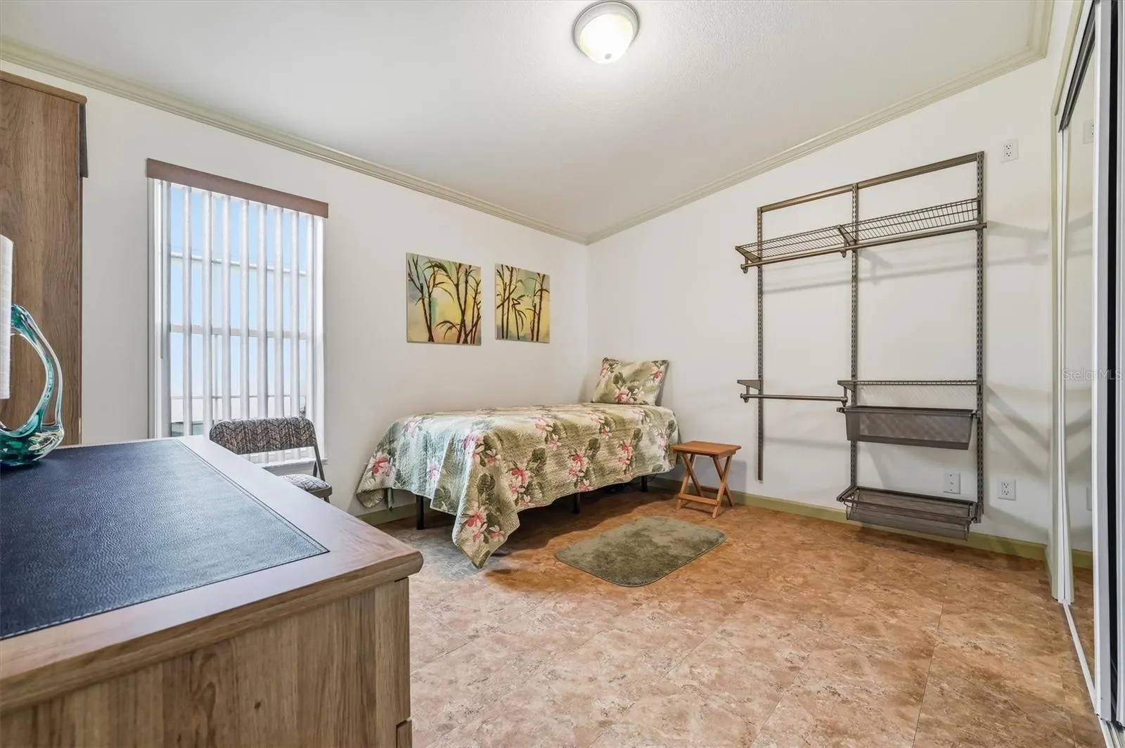 2nd bedroom with large closet and additional racking assembly for storage or guests