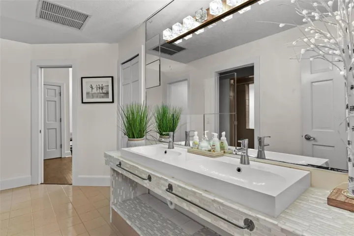 Bathroom # 5 (East Wing - Upstairs. Services the Gym and two bedrooms. This bathroom is a jack and jill bathroom for one of the bedrooms and the gym