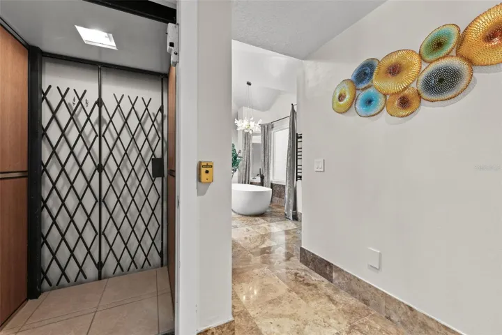 This is the Elevator that gives direct access to the Primary Suite!! You can go down 1 floor to the back of the kitchen area or you can go down further to the garage!