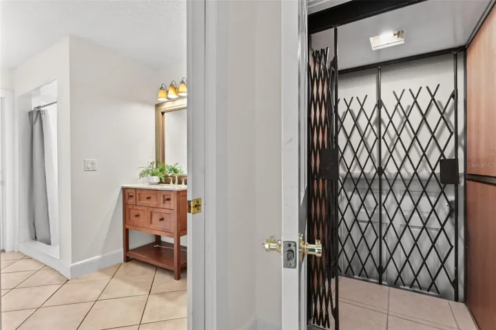 Elevator Access from the back of the kitchen, next to the Full Pool Bathroom and entry from the garage