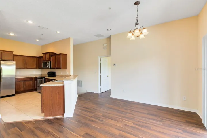 The Living Room, Dining area, and Kitchen flow seamlessly together, creating an INVITING ATMOSPHERE perfect for both relaxing and entertaining.