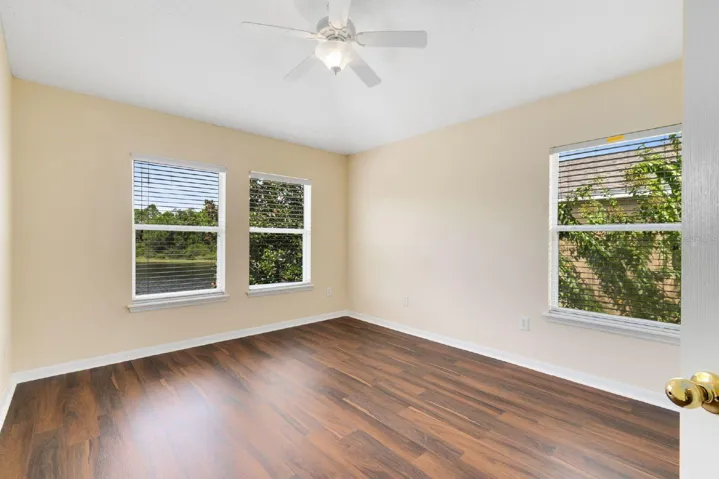 A second SPACIOUS BEDROOM is conveniently located near the additional full bath, ideal for guests, family, or a home office setup.