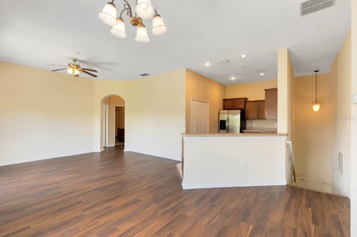 The Living Room, Dining area, and Kitchen flow seamlessly together, creating an INVITING ATMOSPHERE perfect for both relaxing and entertaining.
