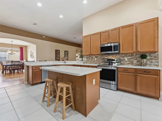 Tiled backsplash, stainless steel appliances, 42