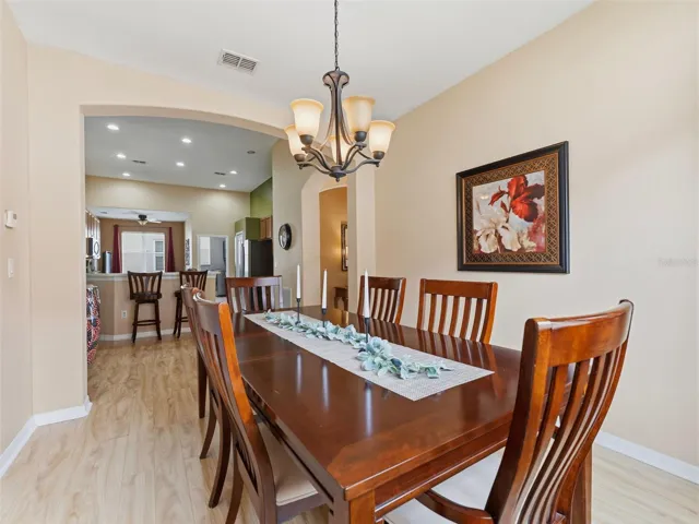 Formal dining space with tasteful lighting fixture